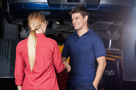 Auto Repair Shop technician talking to customer